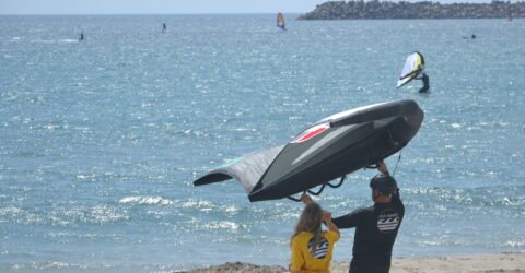 wing foil lesson with our team wing instructor on the beach at kite voodoo portugal morning light wind